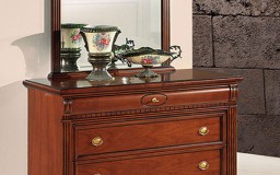 Νεοκλασική κάμαρα με χαρακτηριστικό την οβάλ λεπτομέρεια στο κρεβάτι και στα συρτάρια. 